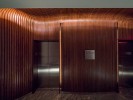 Conrad Hotel Elevator Lobby - a tunnel of bent walnut, fabricated by Pure Timber